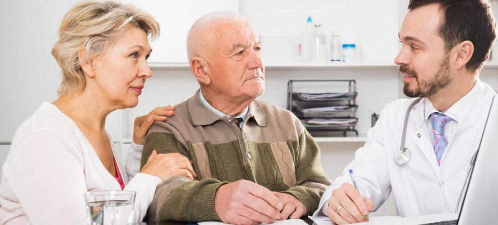 A couple talking to a doctor