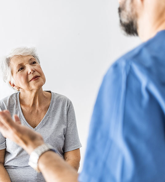 A woman talking to a doctor